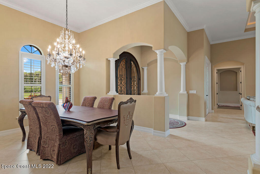 1 Pisces Lane Rockledge, FL 32955 - Photo 12 of 61 a dining room with furniture and window