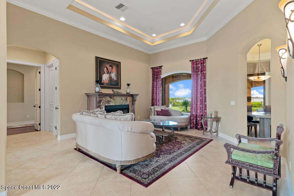 1 Pisces Lane Rockledge, FL 32955 - Photo 14 of 61 a living room with furniture and a fireplace