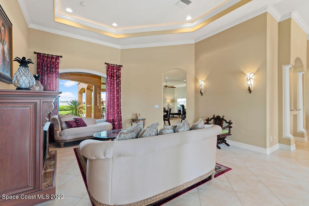 1 Pisces Lane Rockledge, FL 32955 - Photo 15 of 61 a living room with furniture and a potted plant