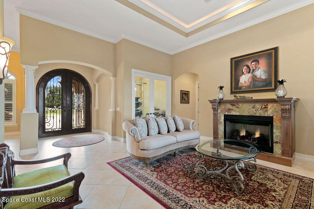 1 Pisces Lane Rockledge, FL 32955 - Photo 17 of 61 a living room with furniture and a fireplace