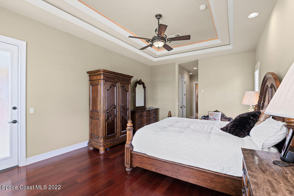 1 Pisces Lane Rockledge, FL 32955 - Photo 19 of 61 a bed room with a bed and a ceiling fan