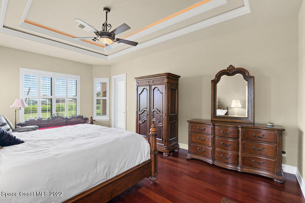 1 Pisces Lane Rockledge, FL 32955 - Photo 20 of 61 a bedroom with a bed and a dresser