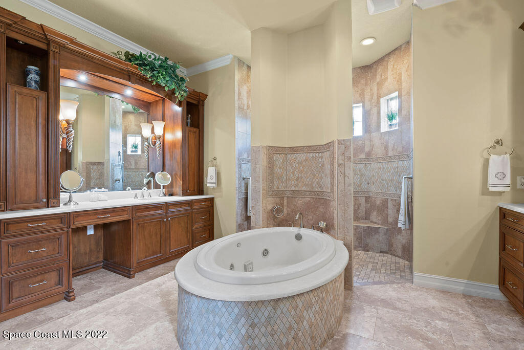 1 Pisces Lane Rockledge, FL 32955 - Photo 23 of 61 a bathroom with a tub sink and mirror