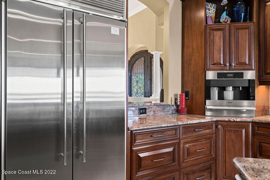 1 Pisces Lane Rockledge, FL 32955 - Photo 26 of 61 a kitchen with stainless steel appliances cabinets and a refrigerator