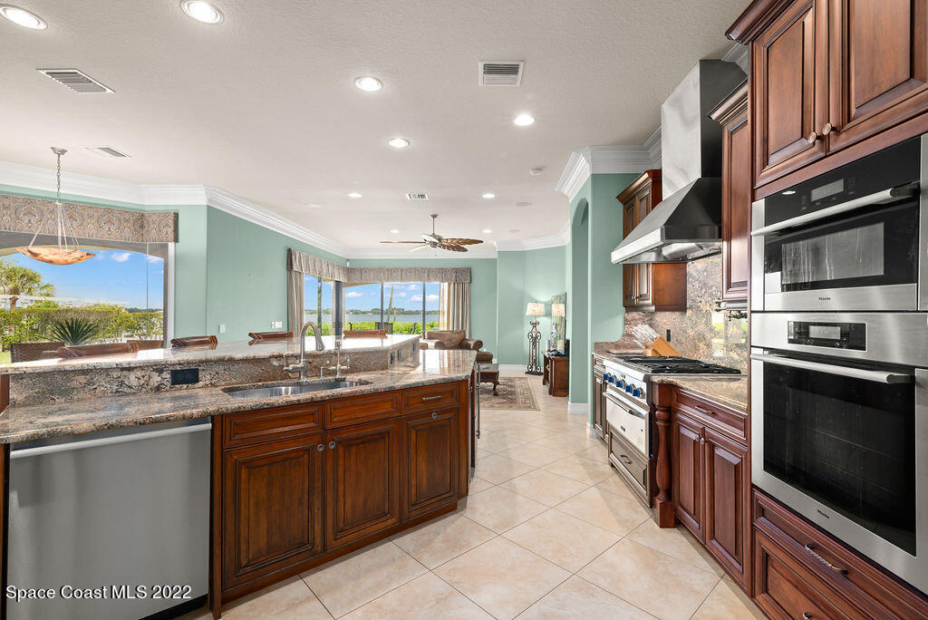 1 Pisces Lane Rockledge, FL 32955 - Photo 29 of 61 Kitchen From Dining Room Archway
