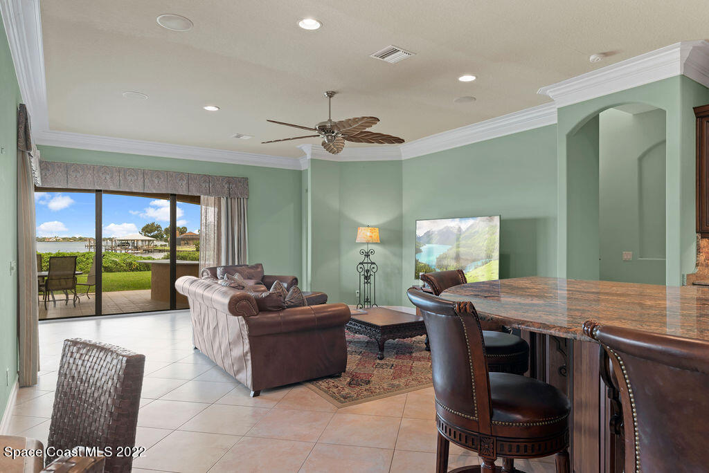 1 Pisces Lane Rockledge, FL 32955 - Photo 3 of 61 a living room with furniture and a large window