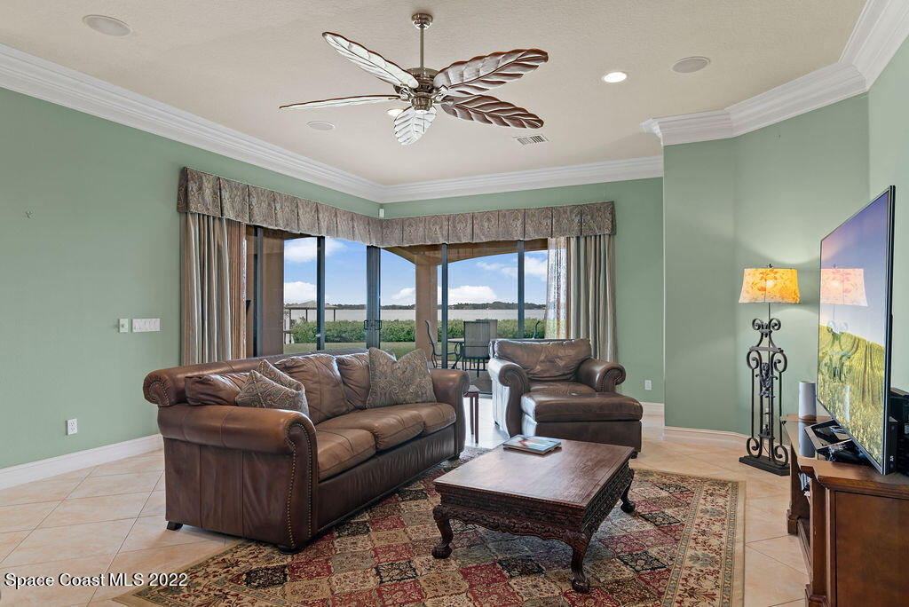 1 Pisces Lane Rockledge, FL 32955 - Photo 31 of 61 a living room with furniture and a flat screen tv