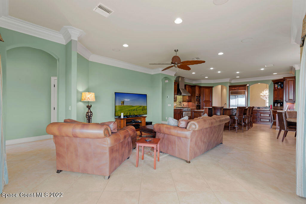 1 Pisces Lane Rockledge, FL 32955 - Photo 33 of 61 a living room with furniture and a flat screen tv