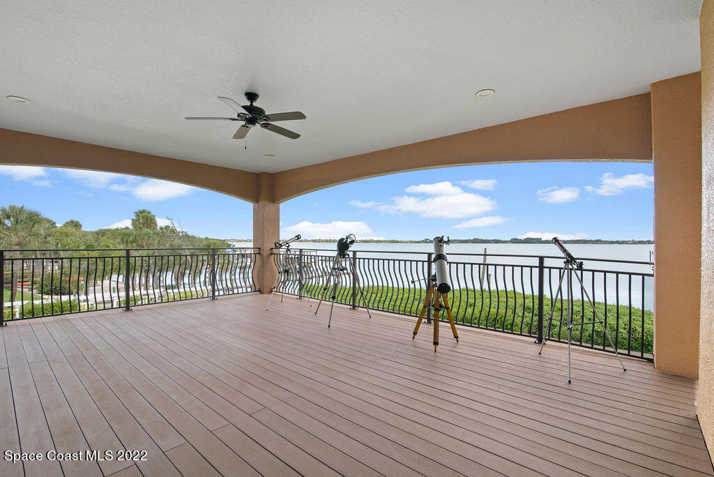 1 Pisces Lane Rockledge, FL 32955 - Photo 37 of 61 a view of a balcony with floor to ceiling windows yard chandelier and ocean view