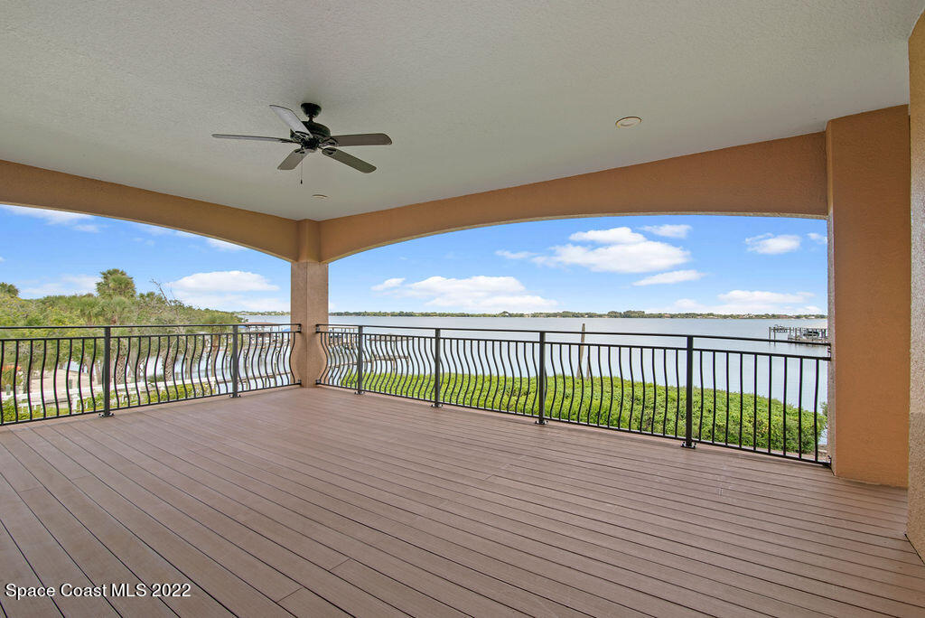 1 Pisces Lane Rockledge, FL 32955 - Photo 38 of 61 a view of a balcony with a floor to ceiling window and wooden floor