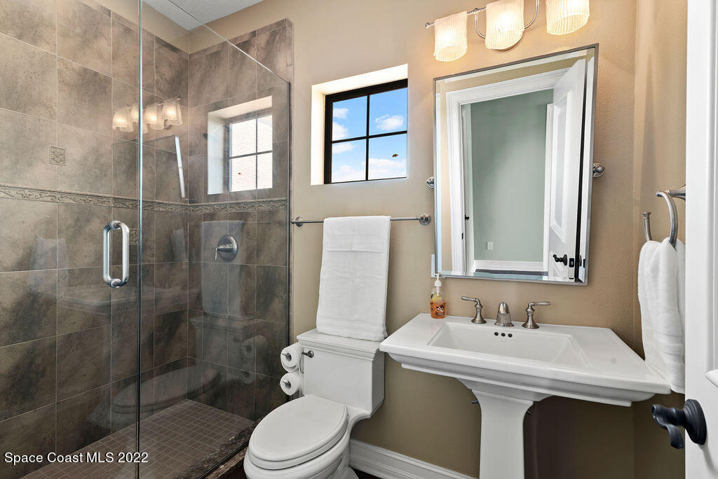 1 Pisces Lane Rockledge, FL 32955 - Photo 43 of 61 a bathroom with a sink toilet and shower