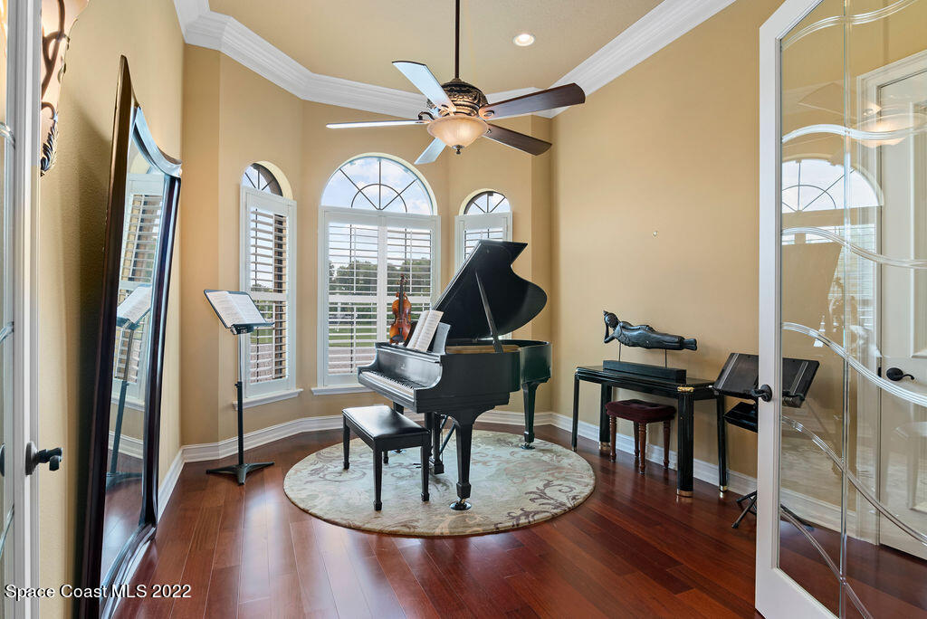 1 Pisces Lane Rockledge, FL 32955 - Photo 44 of 61 a view of a livingroom with furniture and a floor to ceiling window