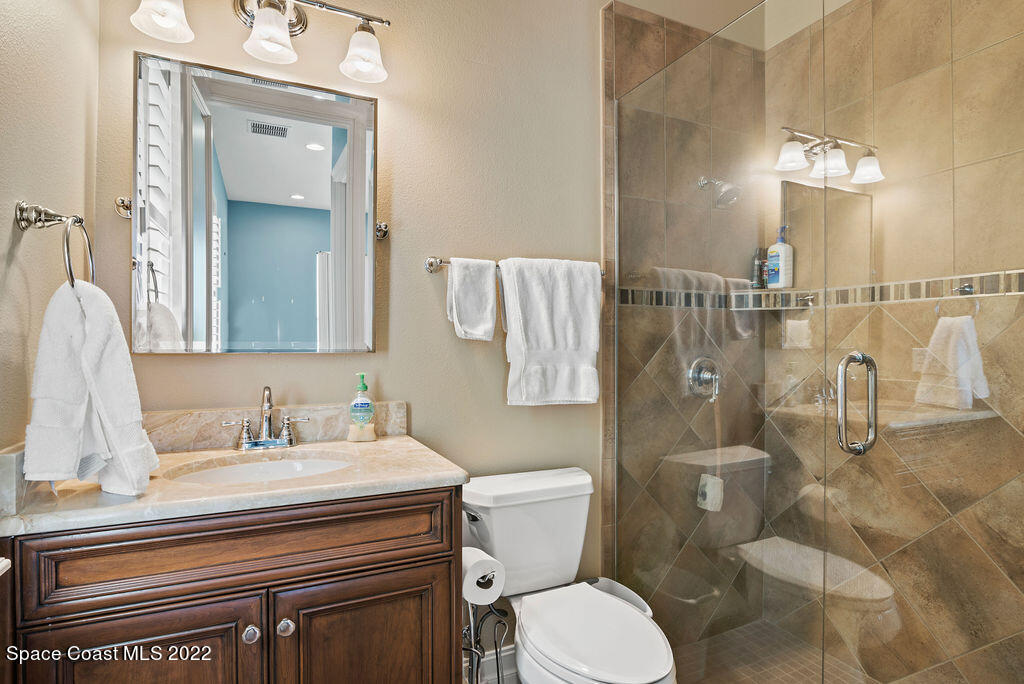 1 Pisces Lane Rockledge, FL 32955 - Photo 48 of 61 a bathroom with a sink a toilet and shower