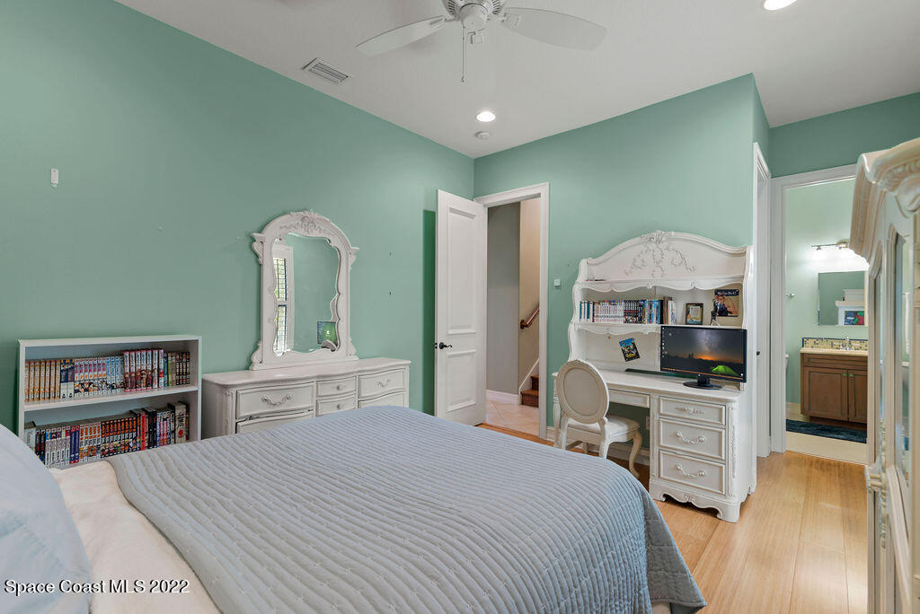 1 Pisces Lane Rockledge, FL 32955 - Photo 50 of 61 a bedroom with a bed and a flat screen tv