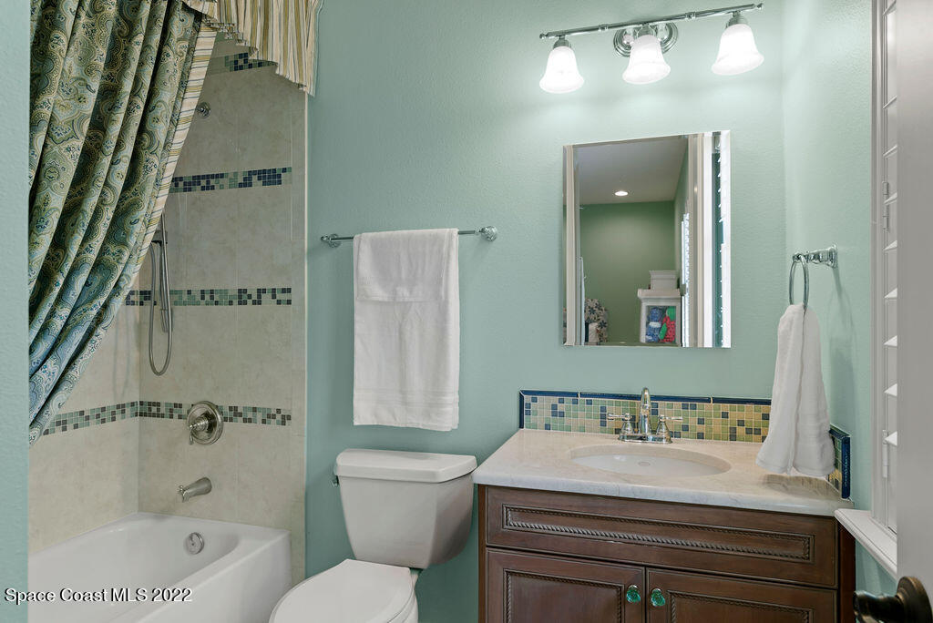 1 Pisces Lane Rockledge, FL 32955 - Photo 51 of 61 a bathroom with a sink a toilet and shower