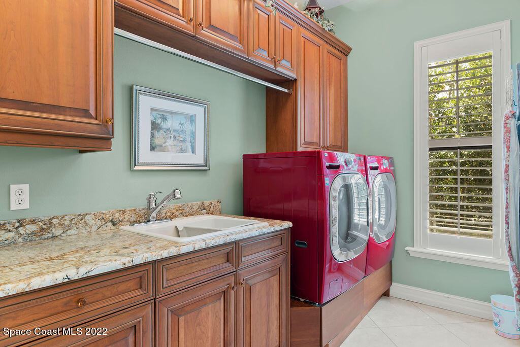 1 Pisces Lane Rockledge, FL 32955 - Photo 52 of 61 a bathroom with a granite countertop sink and a mirror