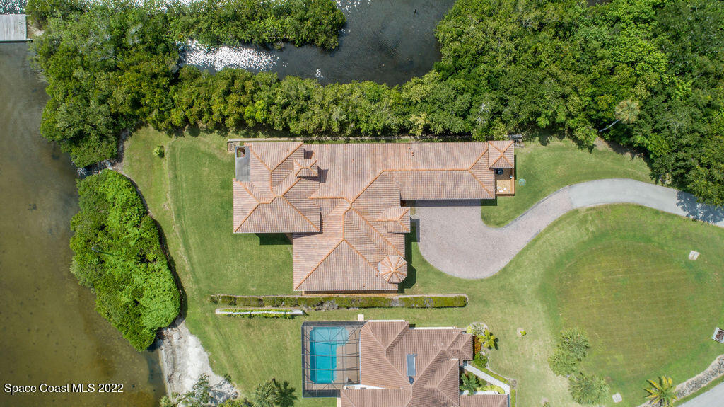 1 Pisces Lane Rockledge, FL 32955 - Photo 55 of 61 an aerial view of residential house with outdoor space and swimming pool