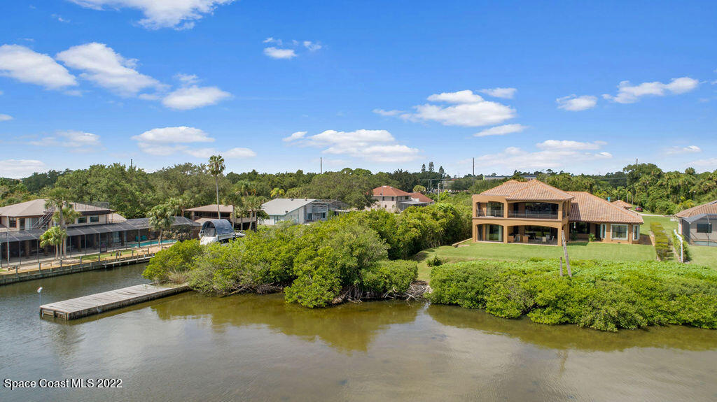 1 Pisces Lane Rockledge, FL 32955 - Photo 59 of 61 an aerial view of a house with swimming pool outdoor seating and yard