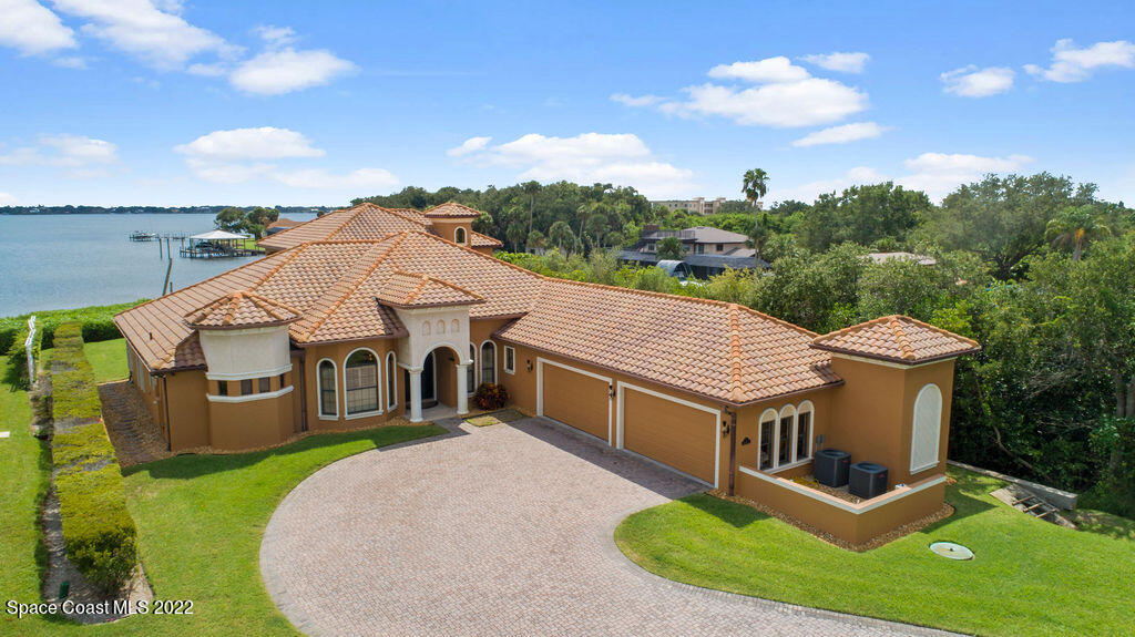 1 Pisces Lane Rockledge, FL 32955 - Photo 7 of 61 an aerial view of a house with swimming pool and garden