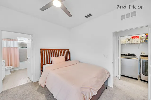 a en suite bathroom with a sink and a mirror