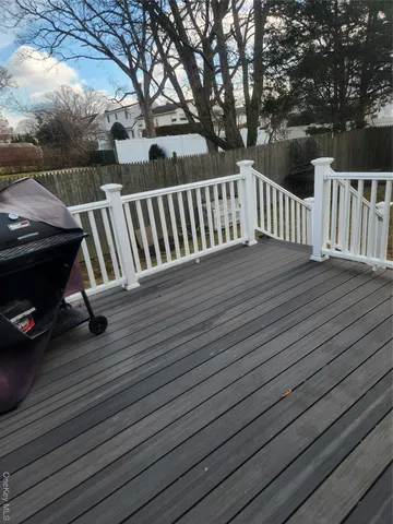 a view of deck with wooden floor and fence