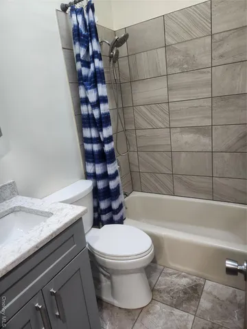 a bathroom with a toilet a sink and bathtub