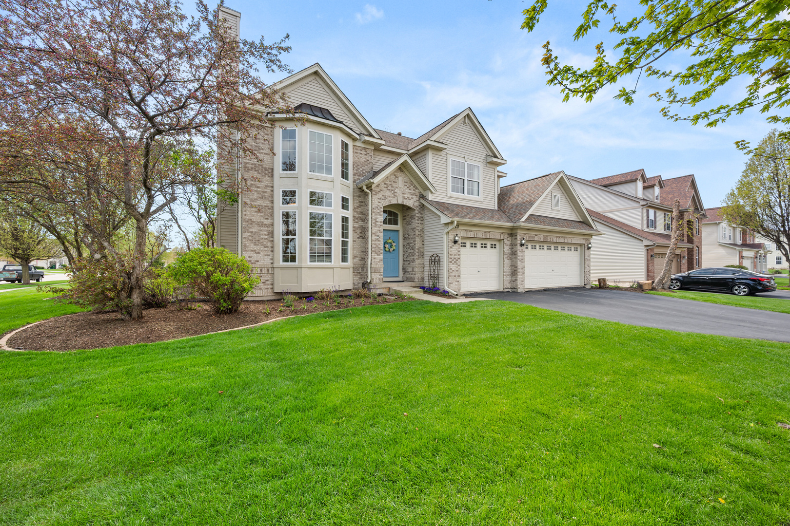 620 Northgate Drive Sycamore, IL 60178 - Photo 2 of 55 a view of a yard in front of a house
