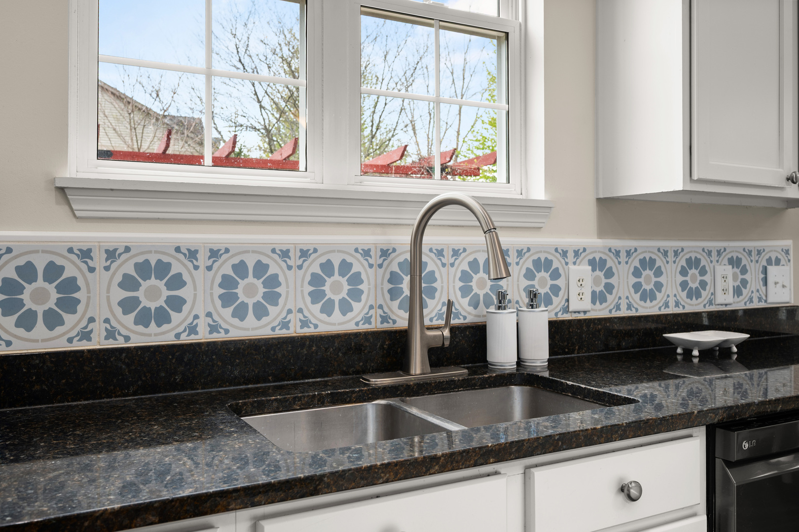 620 Northgate Drive Sycamore, IL 60178 - Photo 25 of 55 a kitchen with granite countertop a sink and a window
