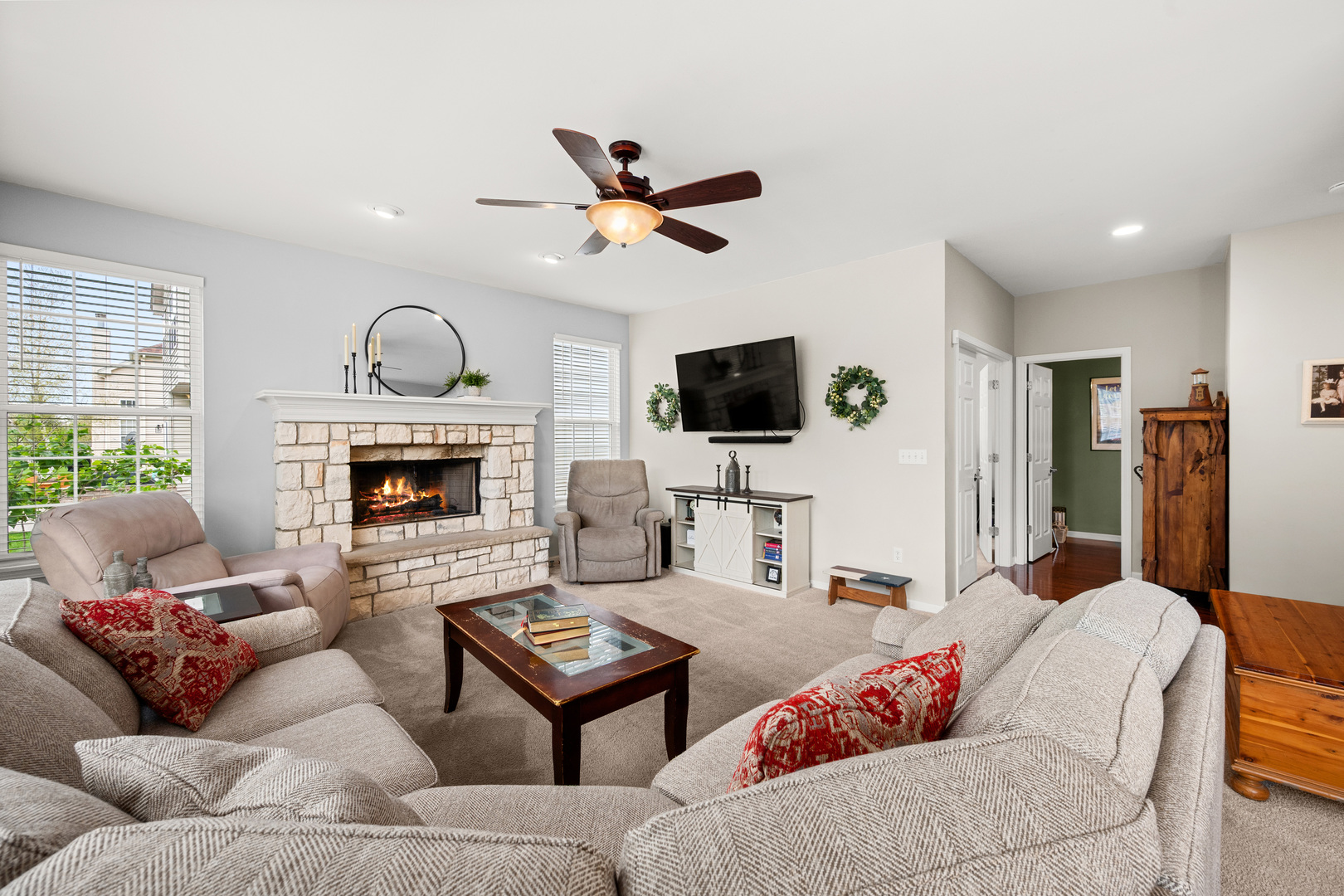 620 Northgate Drive Sycamore, IL 60178 - Photo 30 of 55 a living room with furniture a fireplace and a flat screen tv
