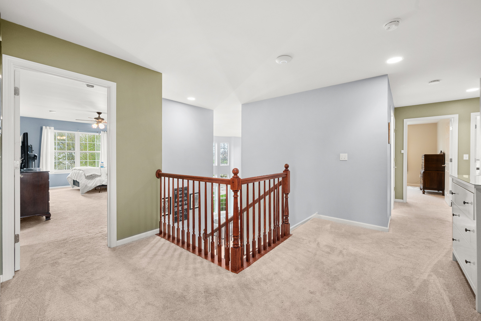 620 Northgate Drive Sycamore, IL 60178 - Photo 36 of 55 a view of a hallway to a room with lots of furniture and windows