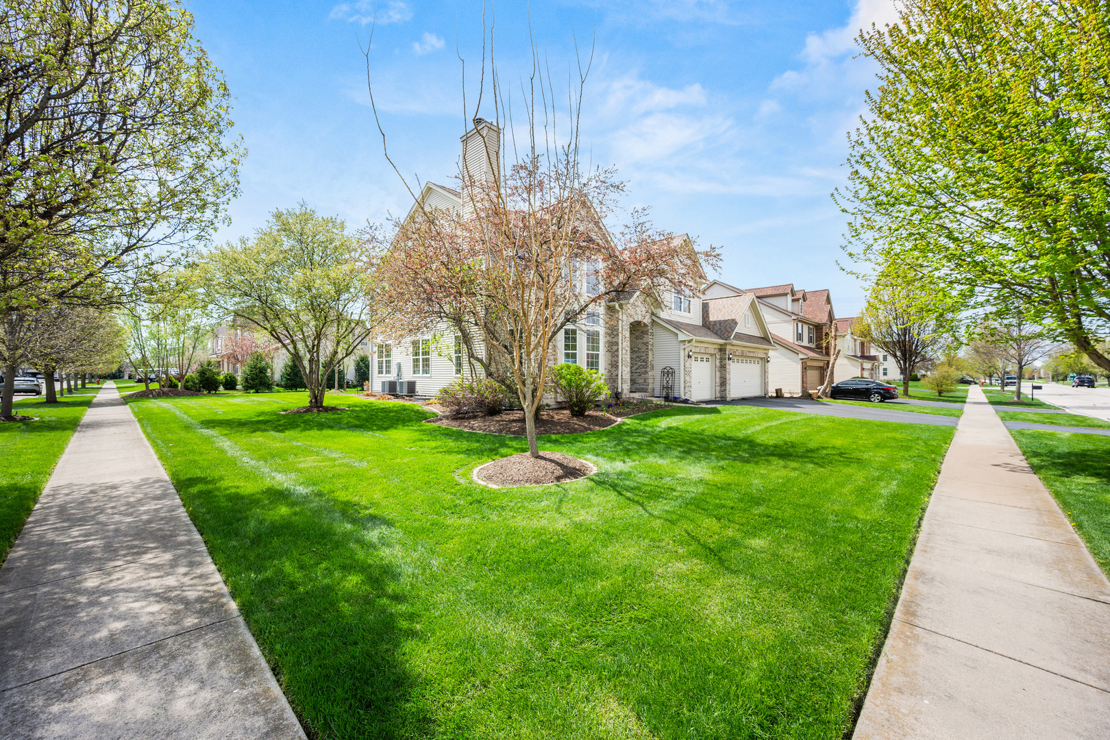 620 Northgate Drive Sycamore, IL 60178 - Photo 5 of 55 a garden with trees in front of it