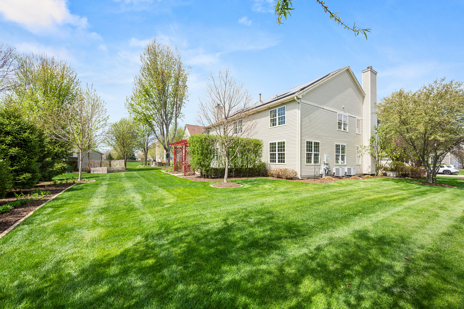 620 Northgate Drive Sycamore, IL 60178 - Photo 6 of 55 a view of a house with backyard and garden