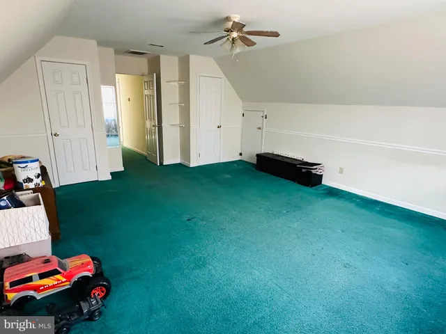 a view of a bedroom with baby toys