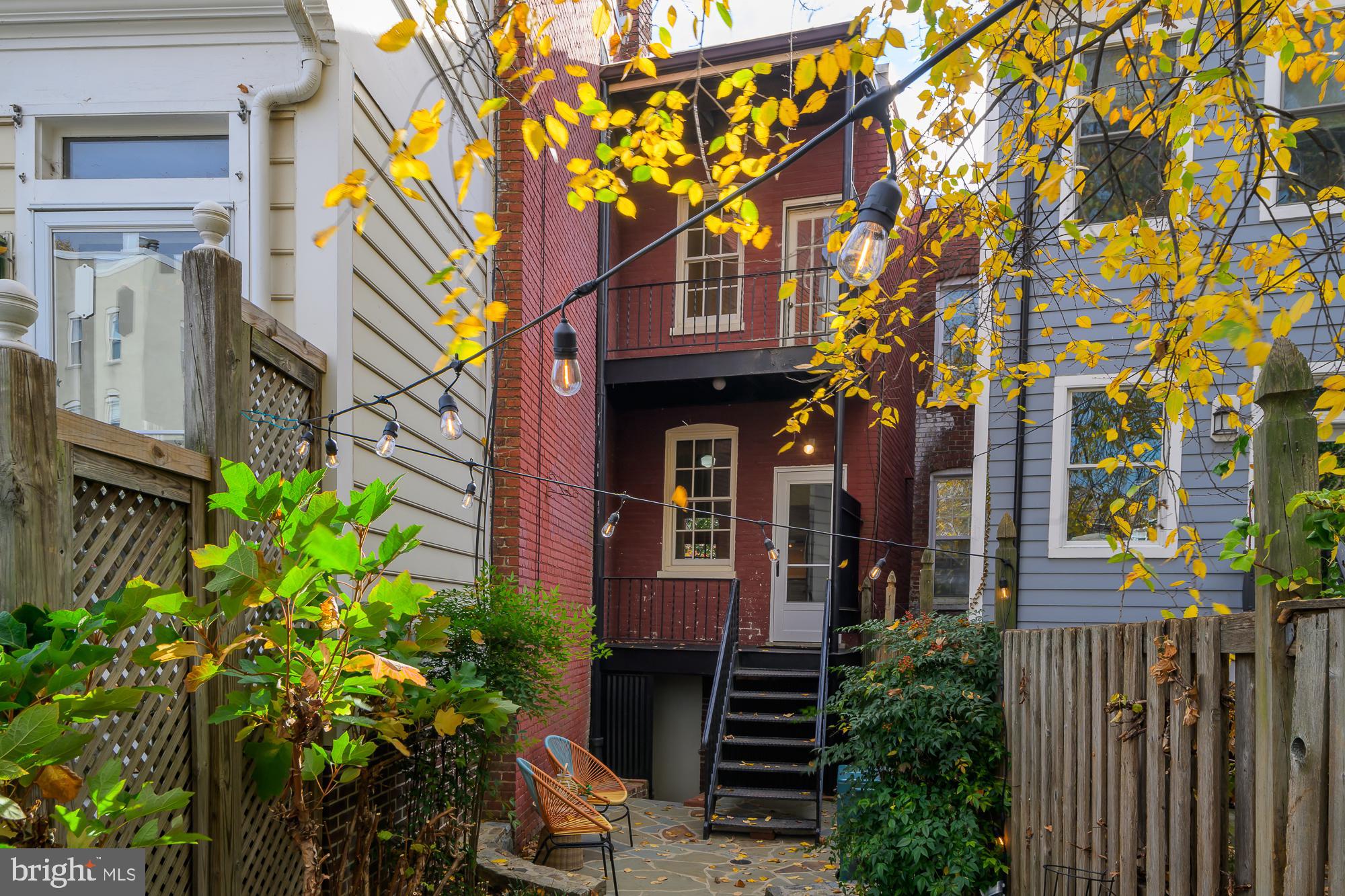 1330 Massachusetts Avenue Southeast Washington, DC 20003 - Photo 14 of 34 a front view of a multi story residential apartment building with a yard