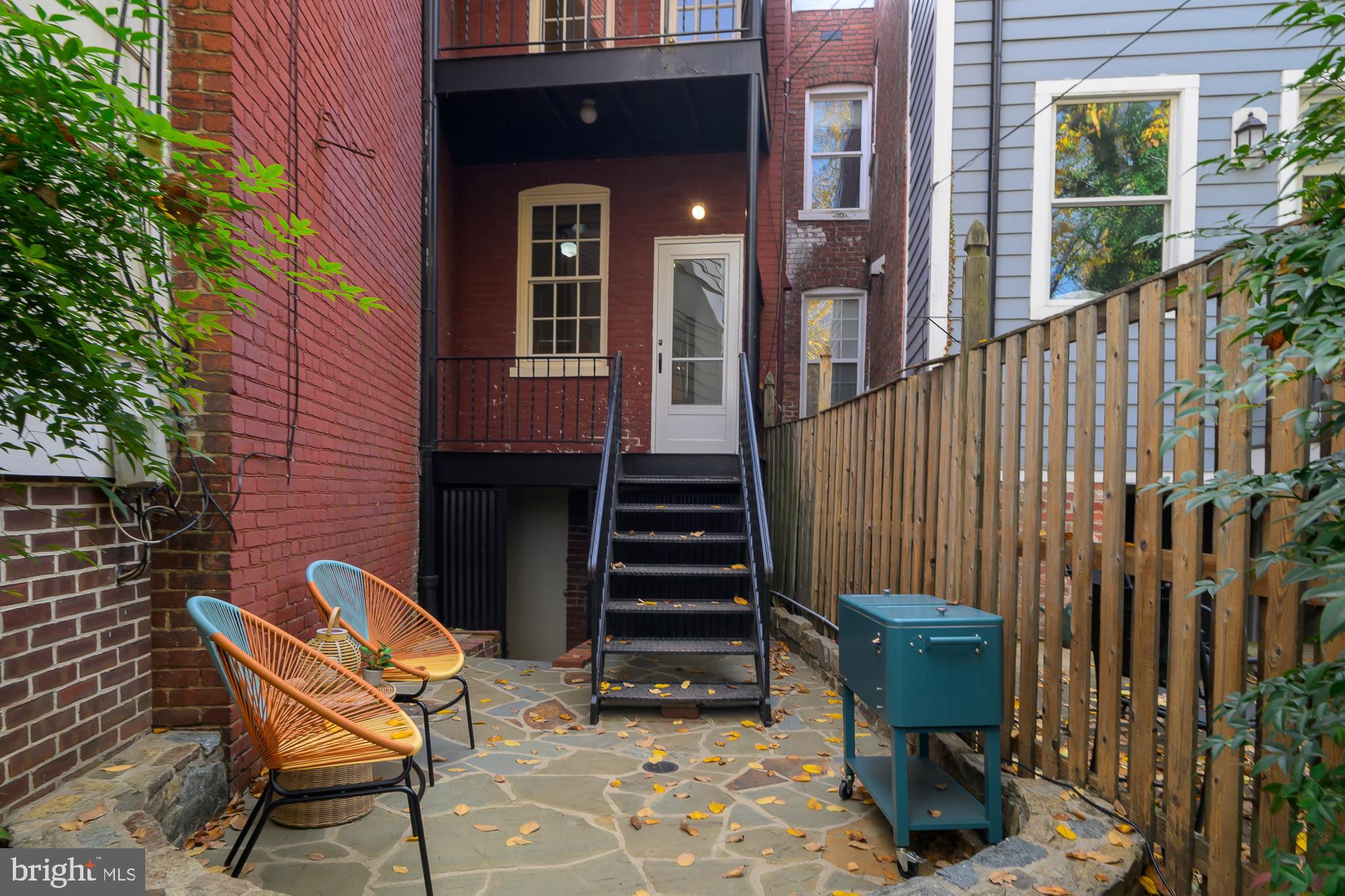 1330 Massachusetts Avenue Southeast Washington, DC 20003 - Photo 15 of 34 a view of a chairs with a bench in the patio