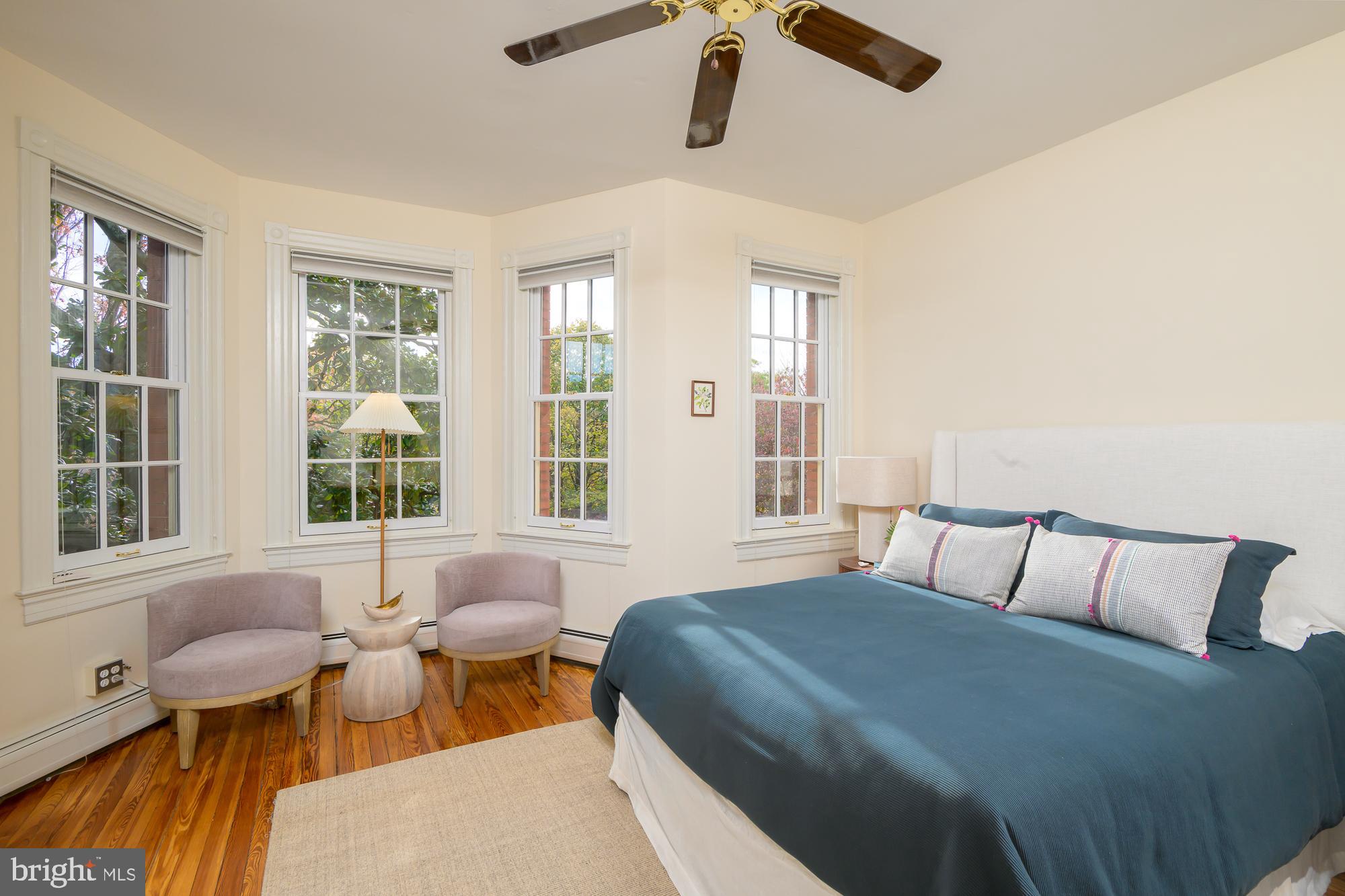 1330 Massachusetts Avenue Southeast Washington, DC 20003 - Photo 17 of 34 a bedroom with a bed and wooden floor