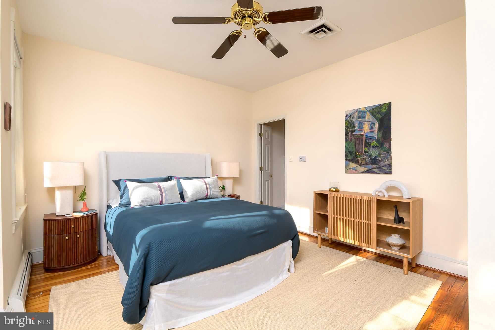 1330 Massachusetts Avenue Southeast Washington, DC 20003 - Photo 18 of 34 a bedroom with a bed and a chandelier