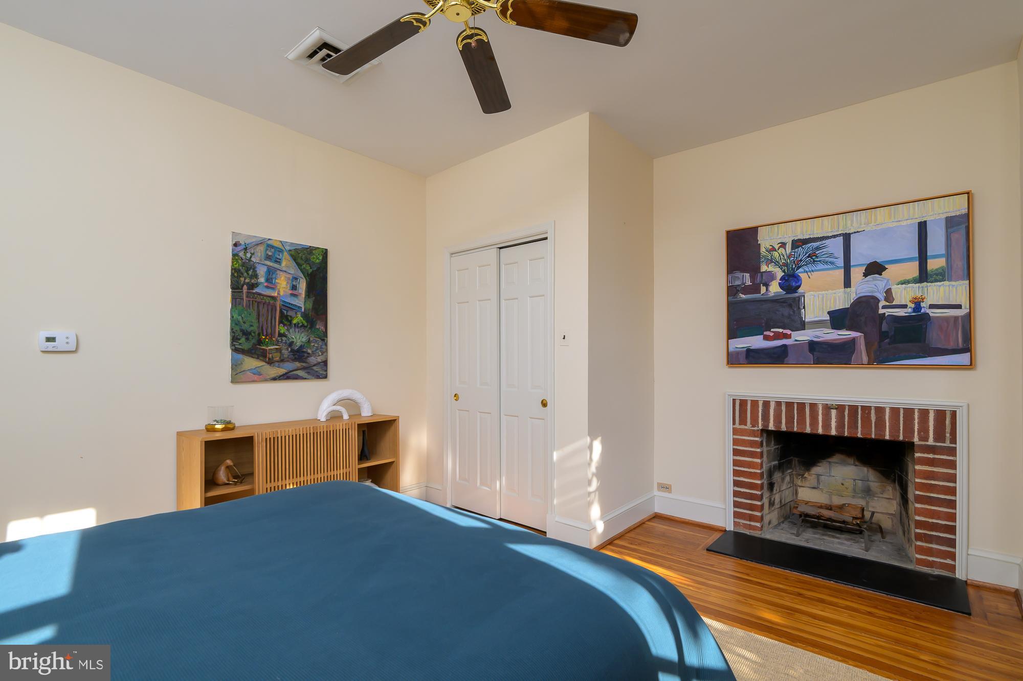 1330 Massachusetts Avenue Southeast Washington, DC 20003 - Photo 19 of 34 a bedroom with a bed and a fireplace