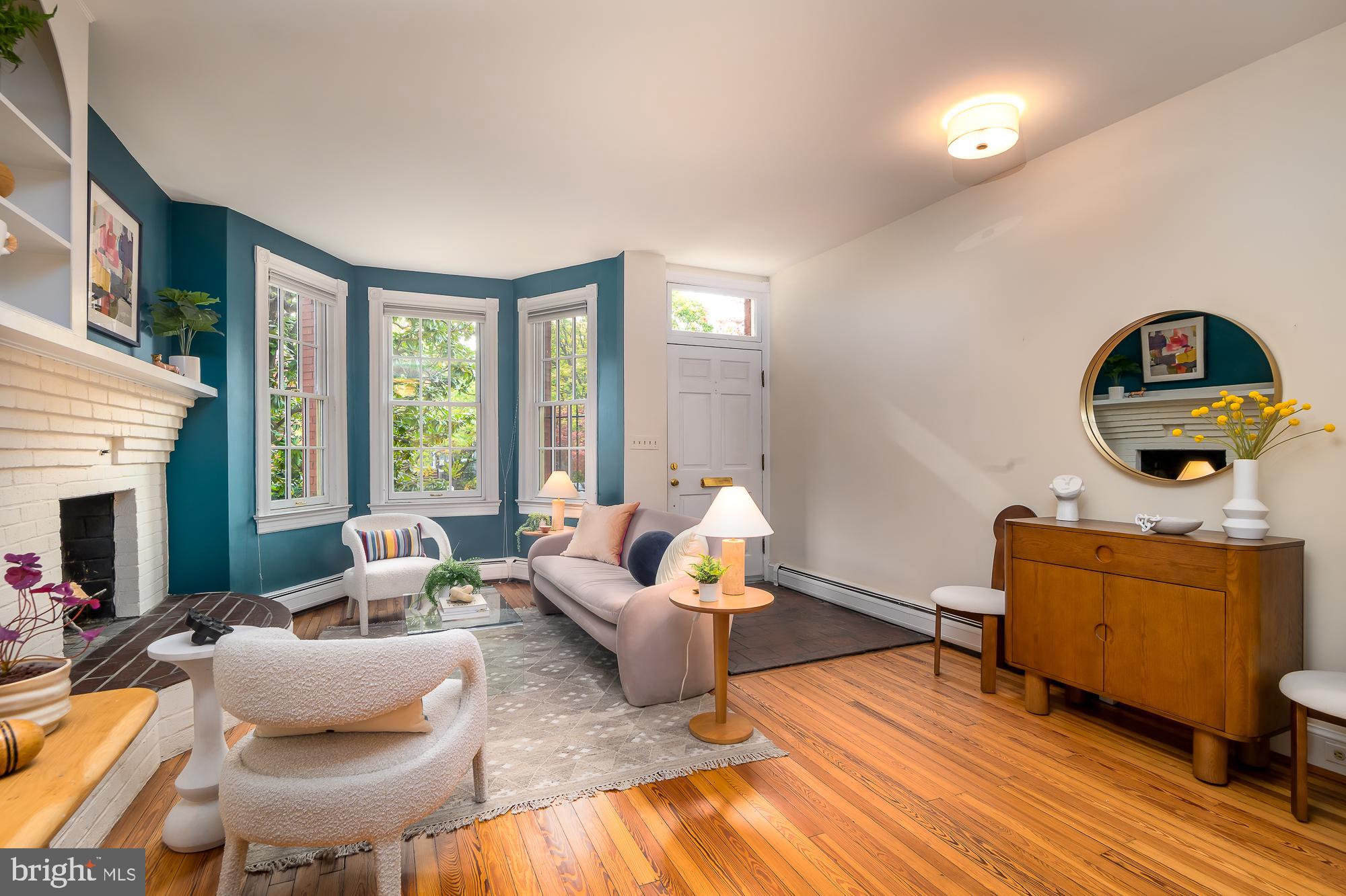 1330 Massachusetts Avenue Southeast Washington, DC 20003 - Photo 2 of 34 a living room with furniture and a fireplace