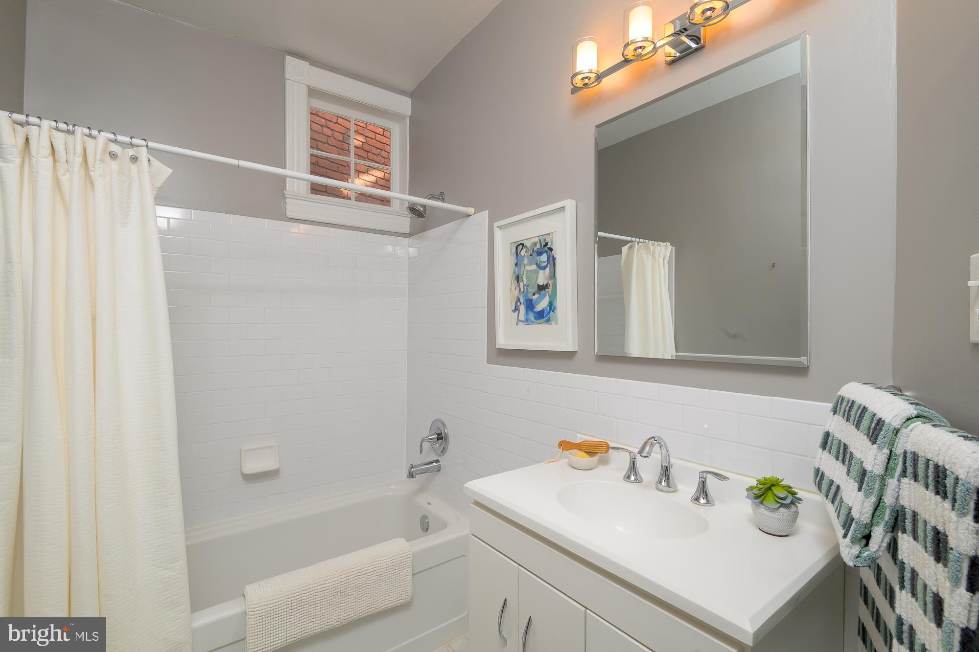 1330 Massachusetts Avenue Southeast Washington, DC 20003 - Photo 25 of 34 a bathroom with a sink a toilet and a bathtub