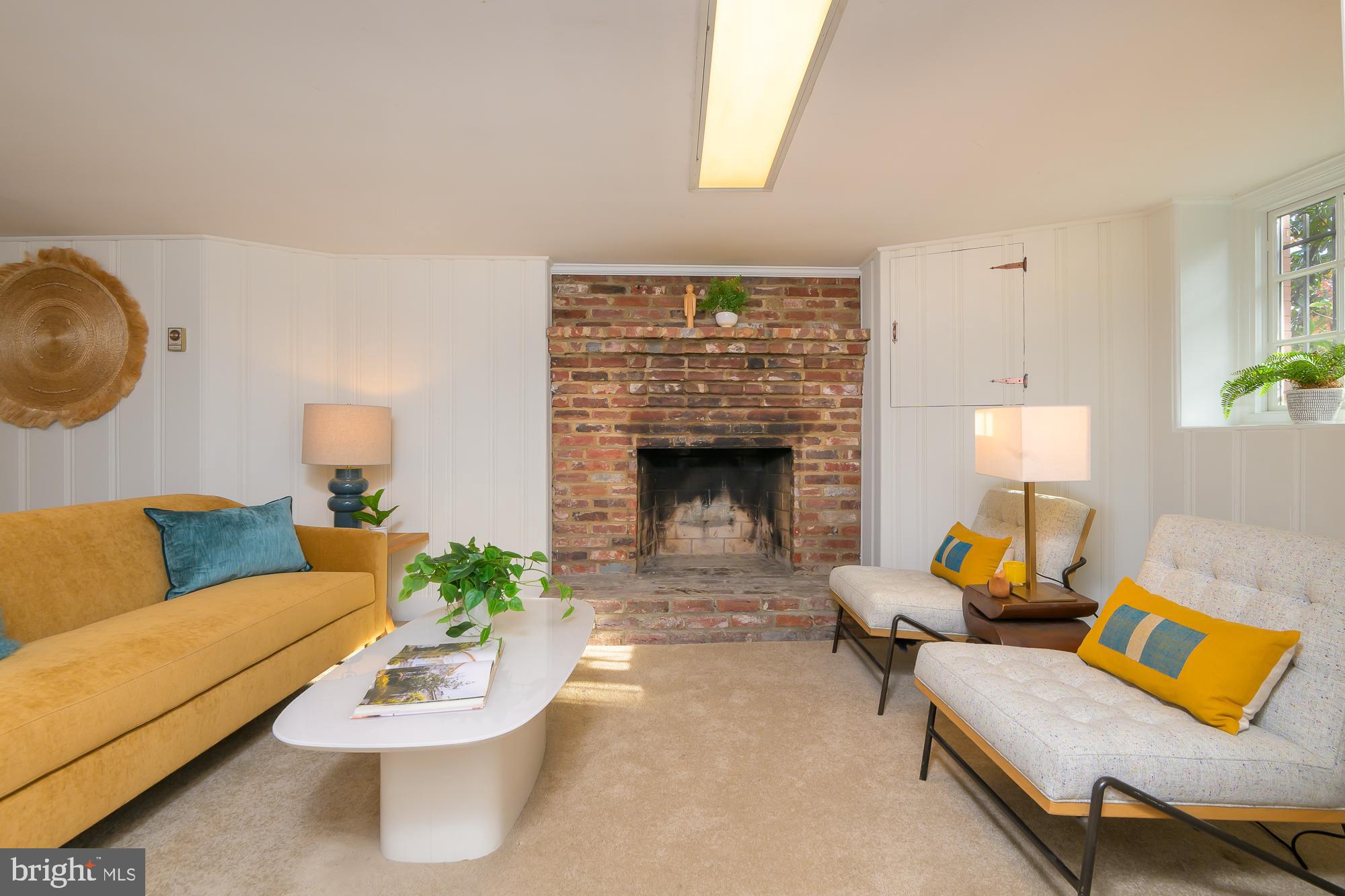 1330 Massachusetts Avenue Southeast Washington, DC 20003 - Photo 27 of 34 a living room with furniture and a fireplace