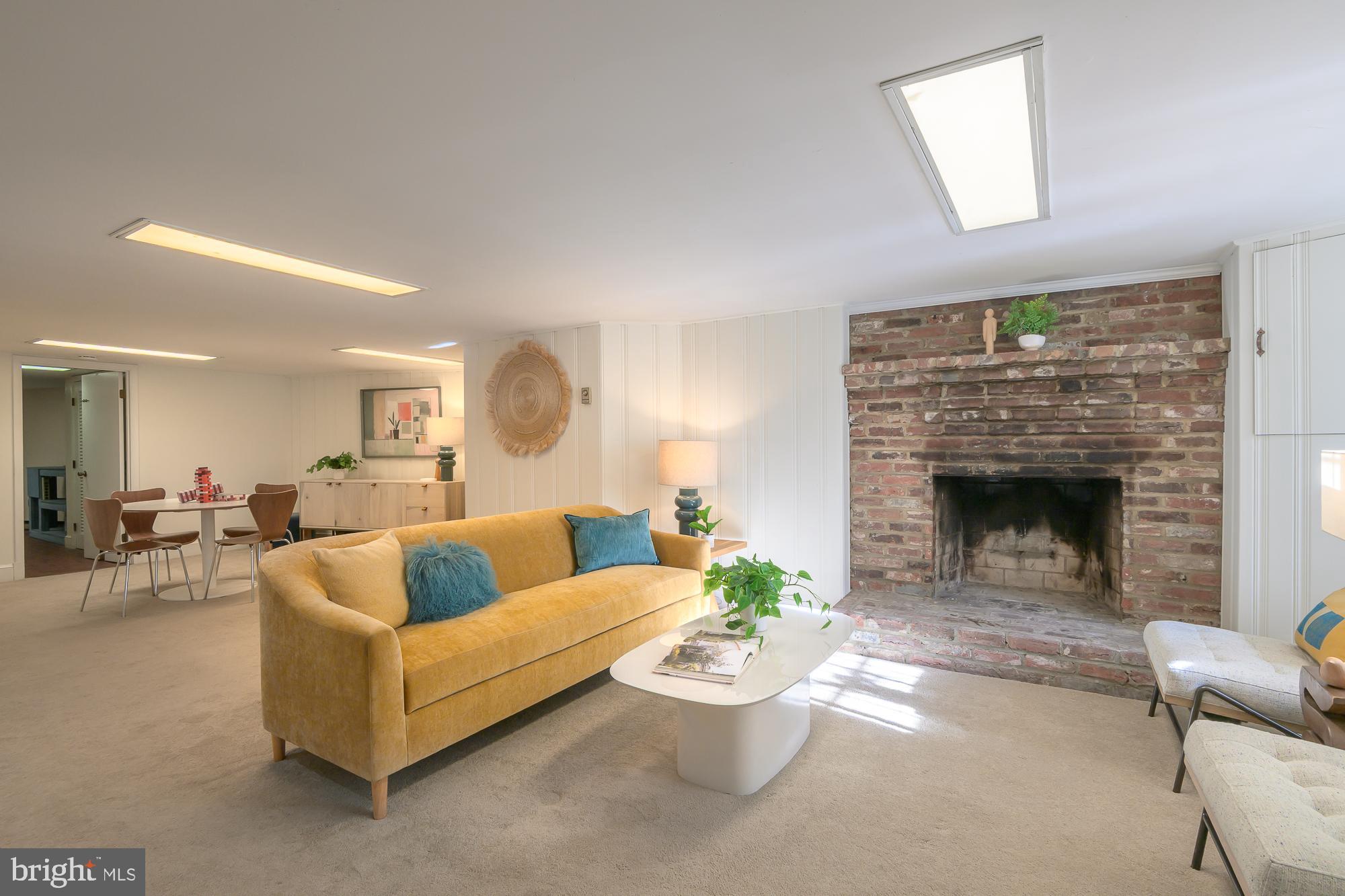 1330 Massachusetts Avenue Southeast Washington, DC 20003 - Photo 28 of 34 a living room with furniture and a fireplace