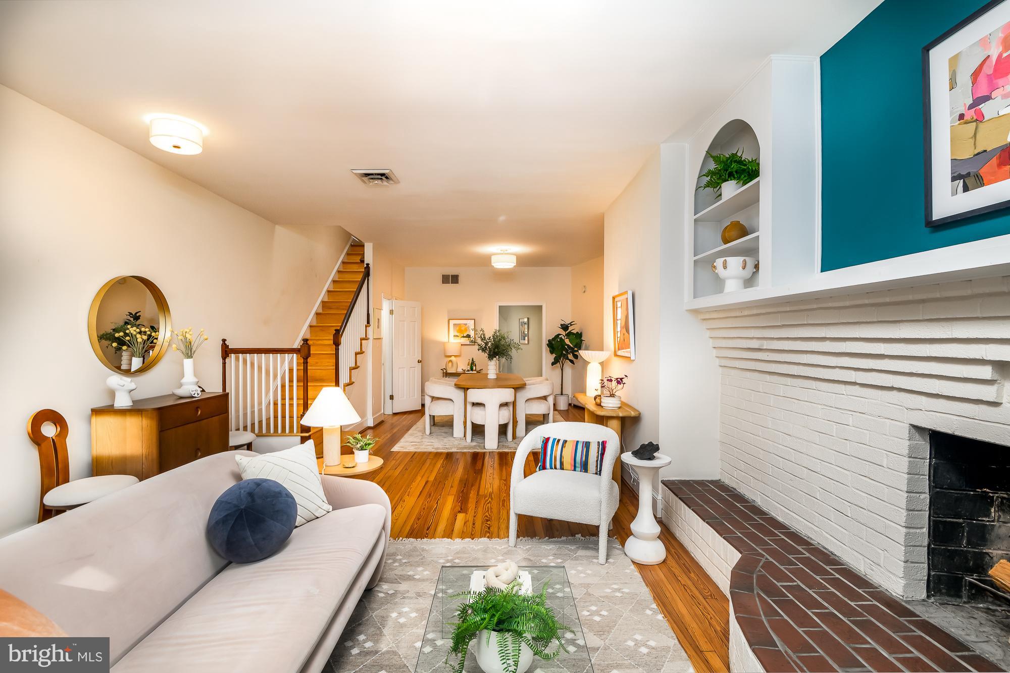 1330 Massachusetts Avenue Southeast Washington, DC 20003 - Photo 6 of 34 a living room with furniture and a fireplace