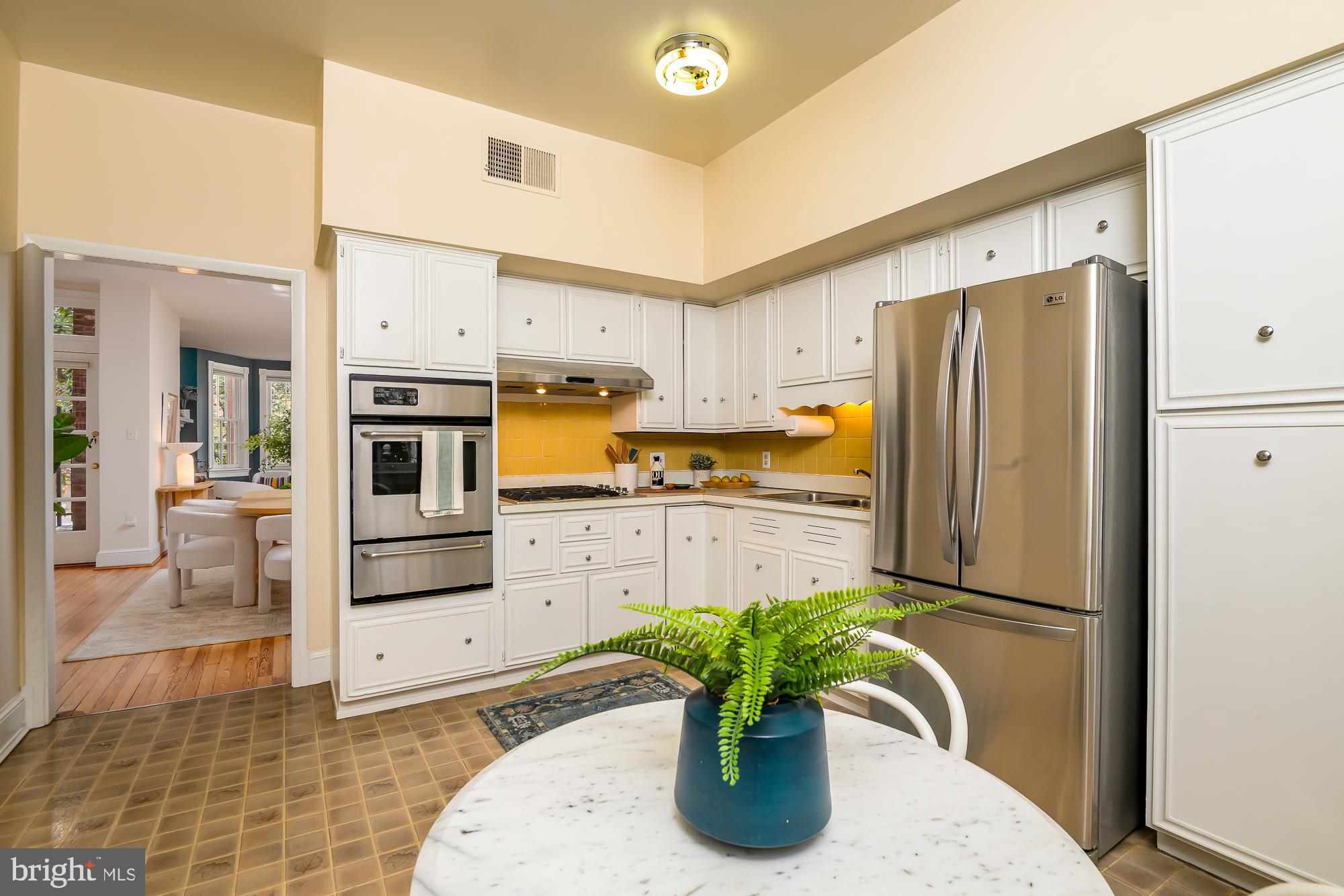 1330 Massachusetts Avenue Southeast Washington, DC 20003 - Photo 10 of 34 a kitchen with stainless steel appliances granite countertop a refrigerator a stove and a sink