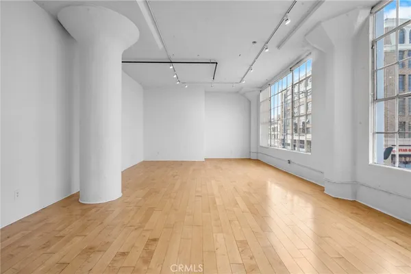 a view of empty room with windows
