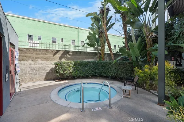 a swimming pool with an outdoor seating
