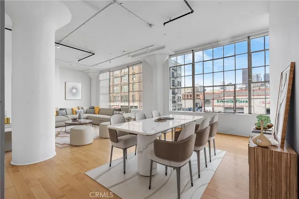 a view of a dining room with furniture window and outside view