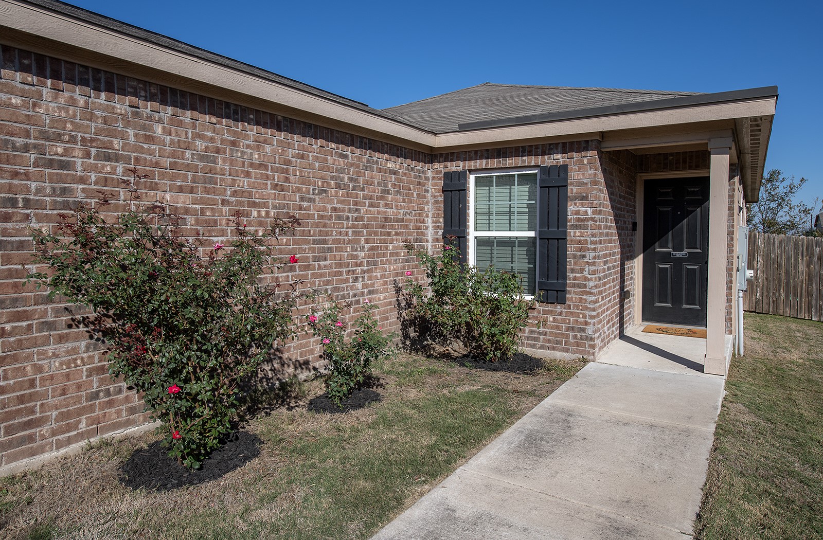 216 Millers Loop Jarrell, TX 76537 - Photo 3 of 31 Entrance to property featuring brick siding