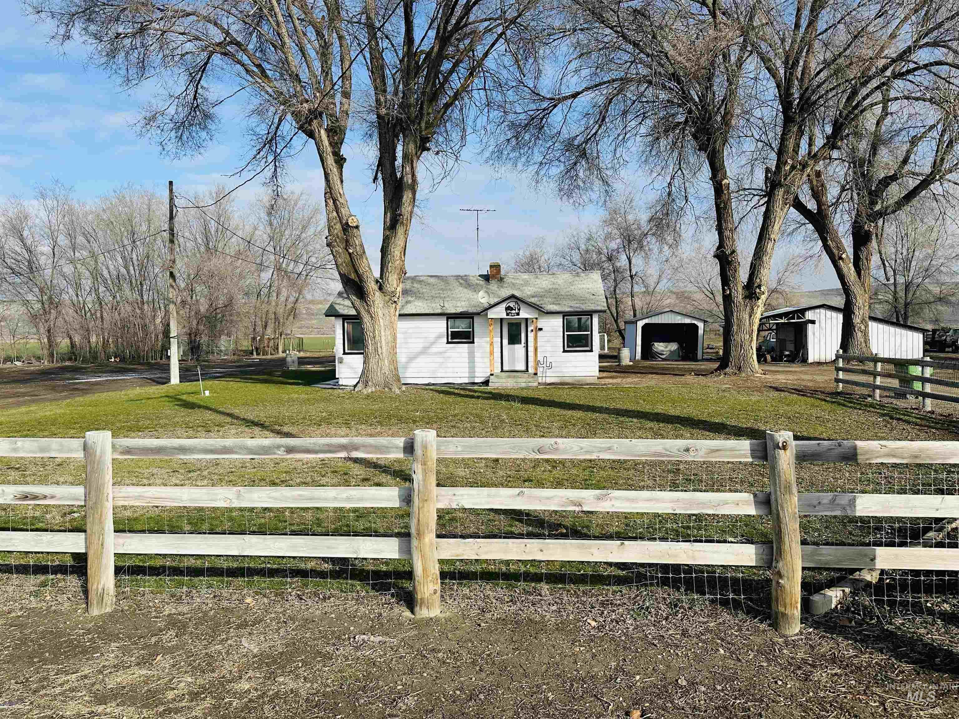 260 Highway 95 Weiser, ID 83672 - Photo 2 of 31 Bungalow with a fenced front yard and a garage