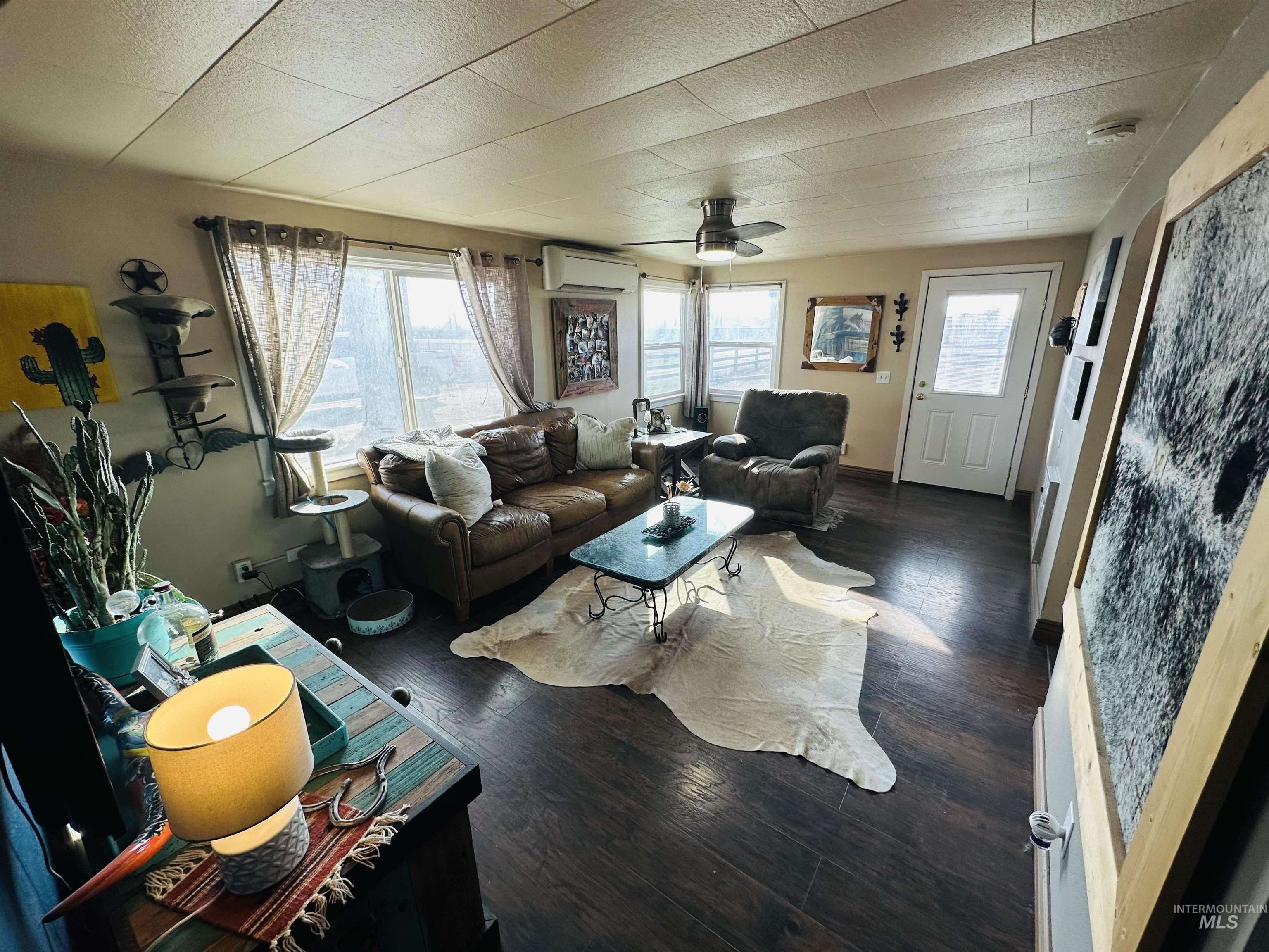 260 Highway 95 Weiser, ID 83672 - Photo 9 of 31 Living room with wood-type flooring, a ceiling fan, and a wall mounted AC